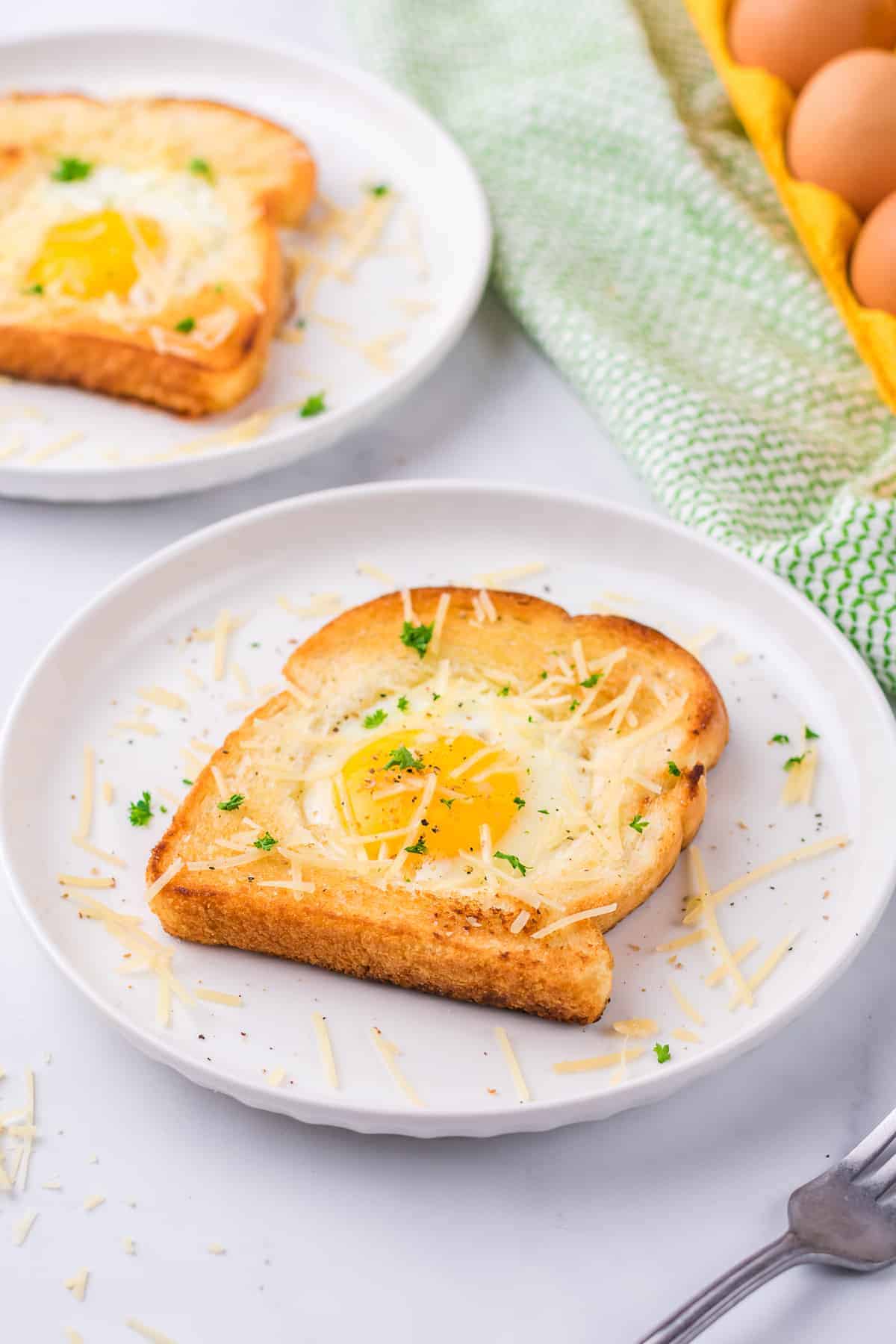 Two slices of toast with an egg on top, also known as Eggs in a Hole.