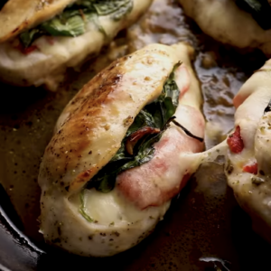 Cooked chicken breasts are in a skillet.