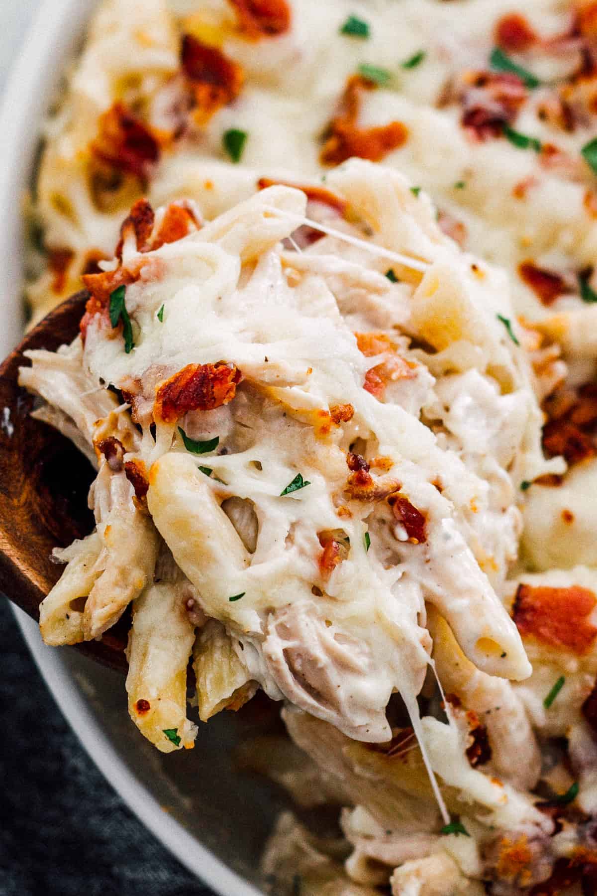 lifting up cheesy chicken bacon ranch pasta bake