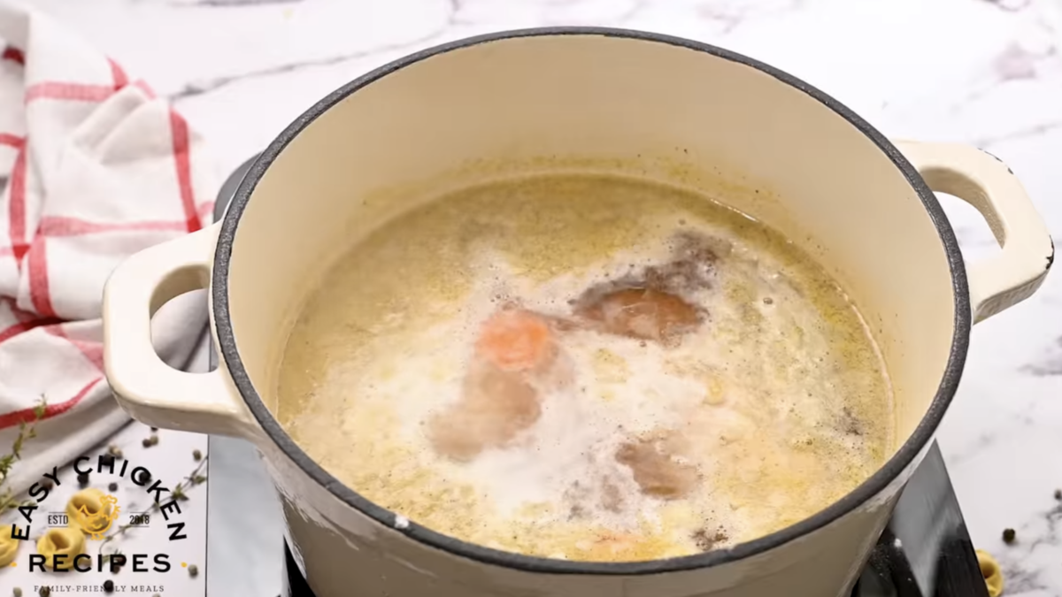 Soup is boiling in a pot. 