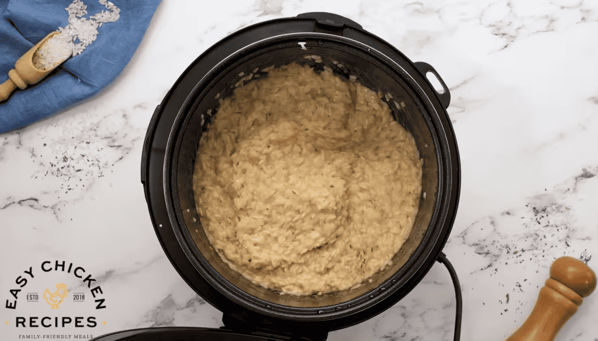 Cooked rice is presented in a pressure cooker. 