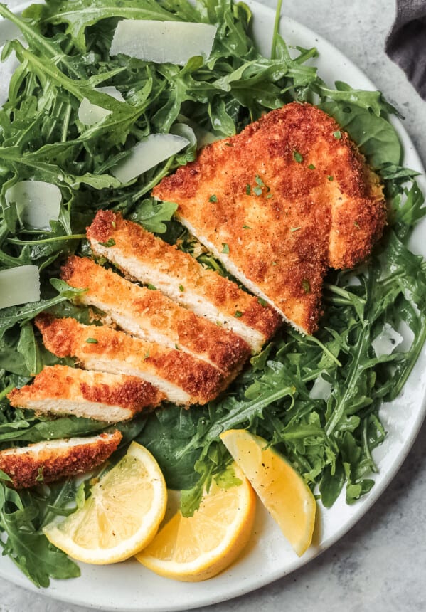up close image of chicken milanese sliced and breaded