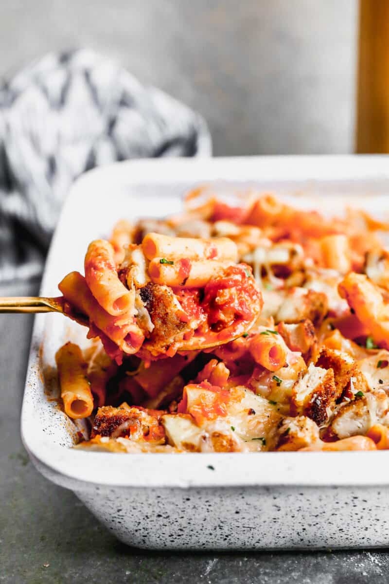spoon lifting out of chicken parm pasta bake