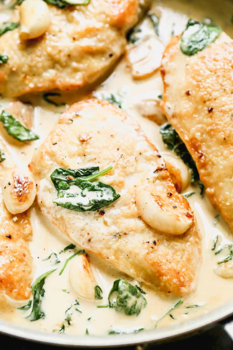 up close image of chicken in creamy garlic sauce with spinach