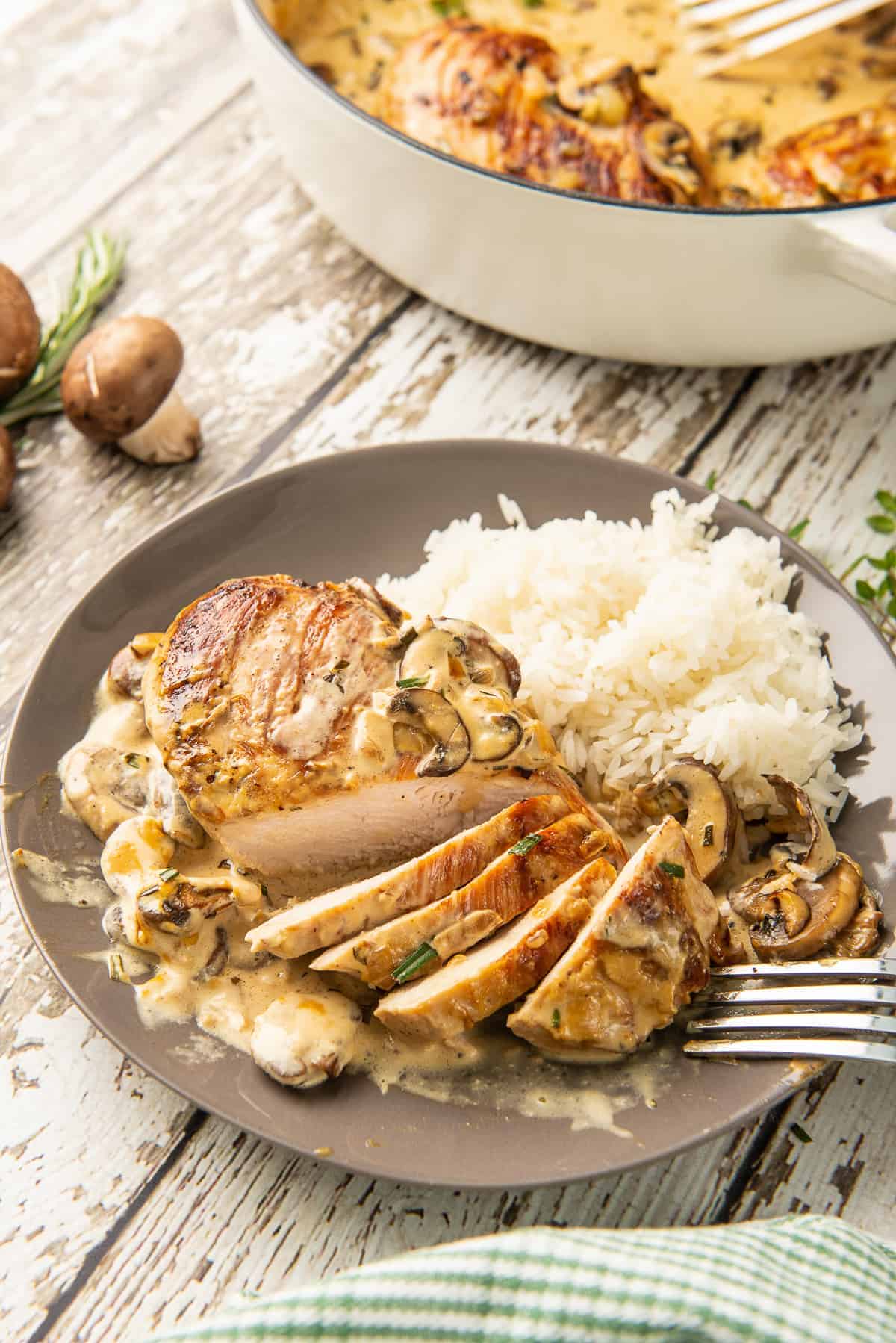 sliced chicken in mushroom sauce on plate