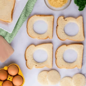 slices of bread with holes cut out of the middles.