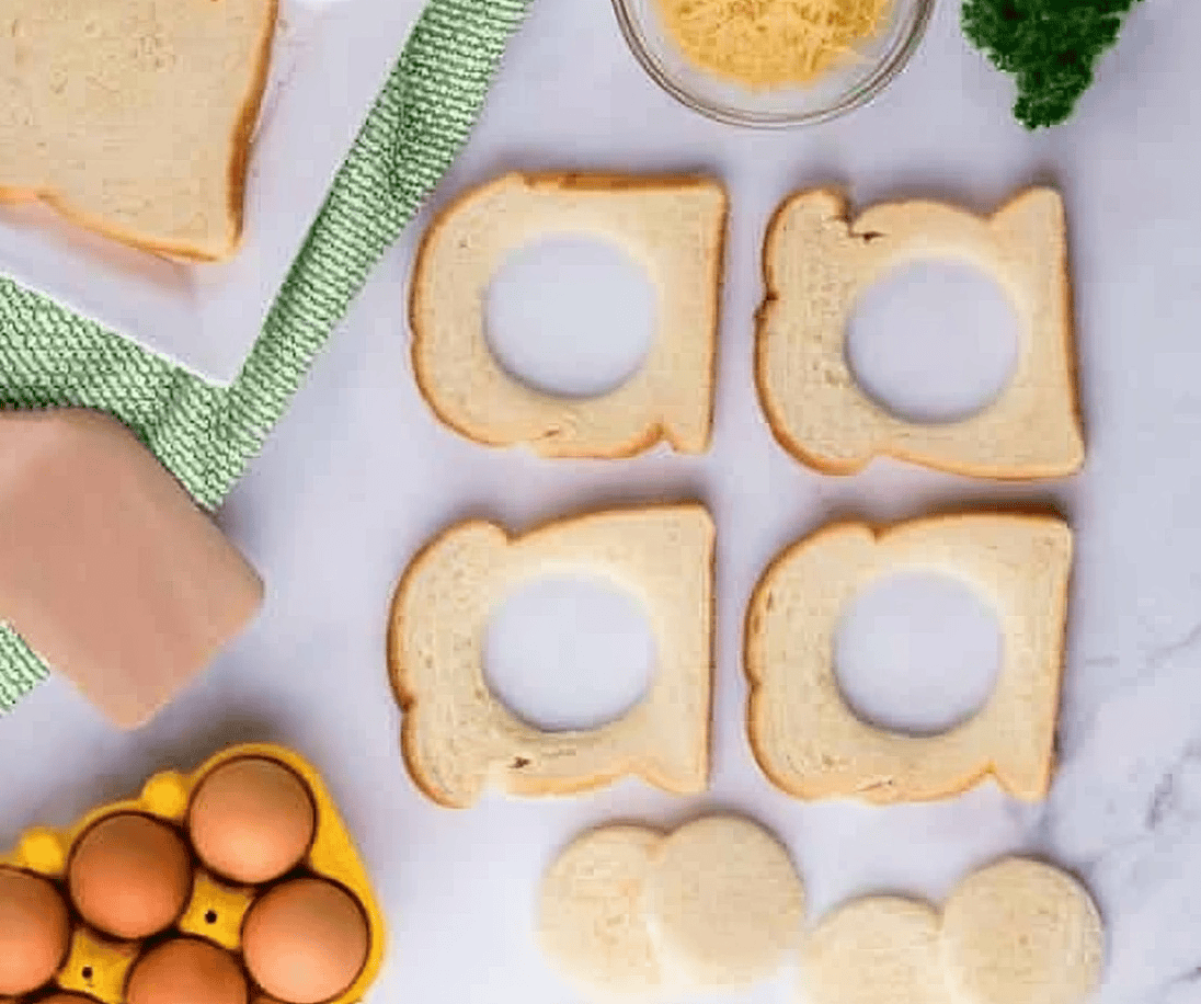 slices of bread with holes cut out of the middles.