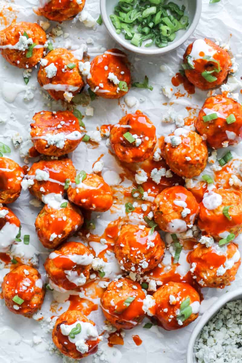 chicken meatballs with buffalo sauce on parchment