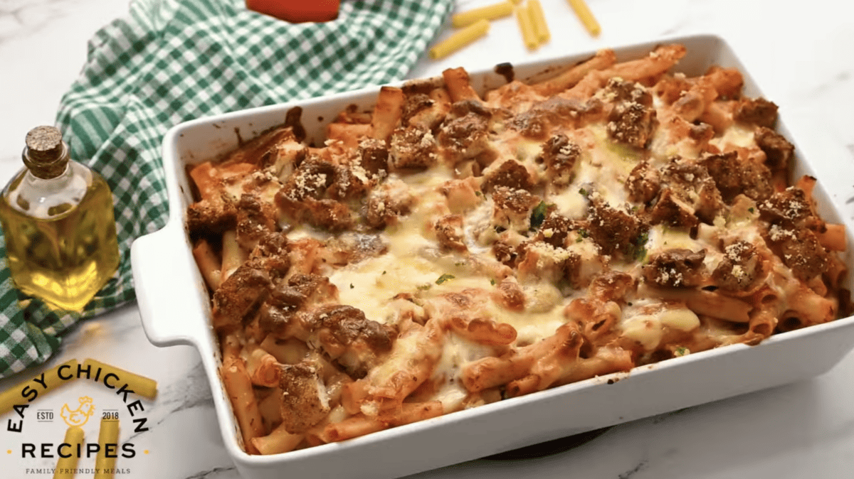 Baked chicken ziti is in a baking dish. 