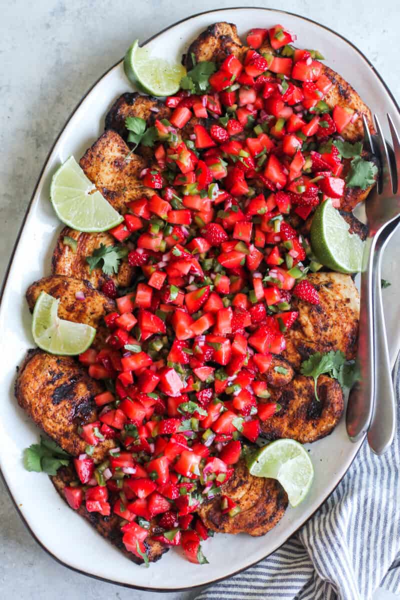 grilled chicken breast with strawberry salsa on platter