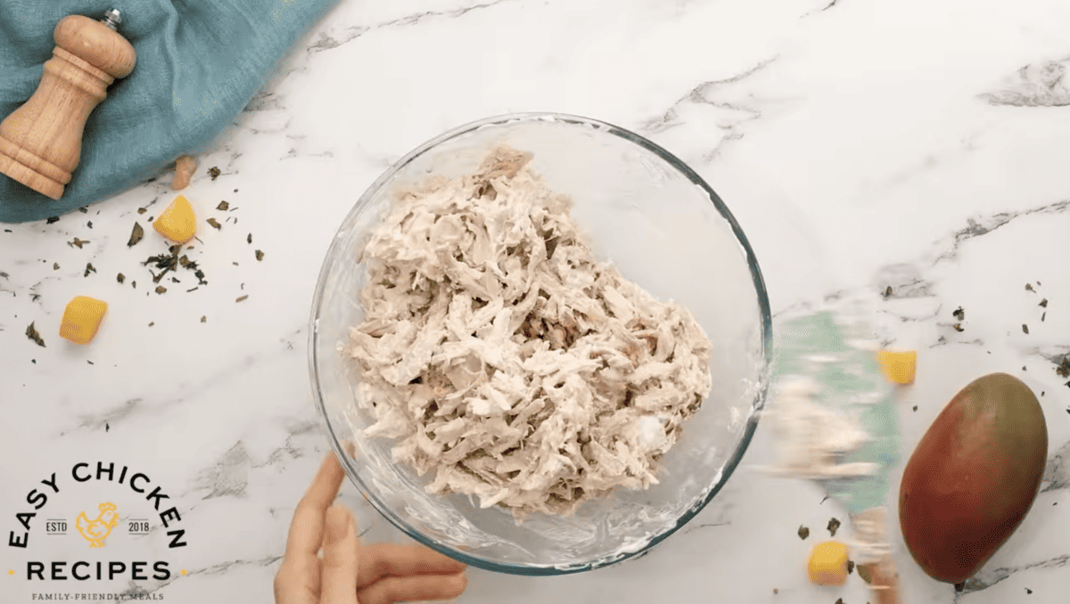 Shredded chicken is mixed with mayonnaise and greek yogurt. 