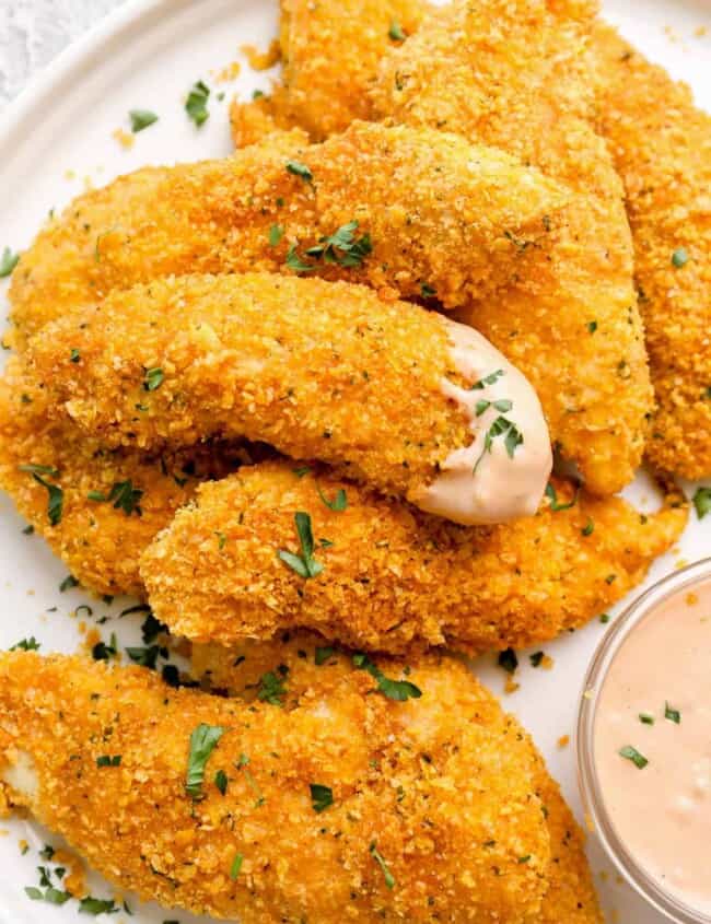 chicken tenders dipped in sauce