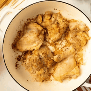 cooked chicken thighs in a dutch oven.