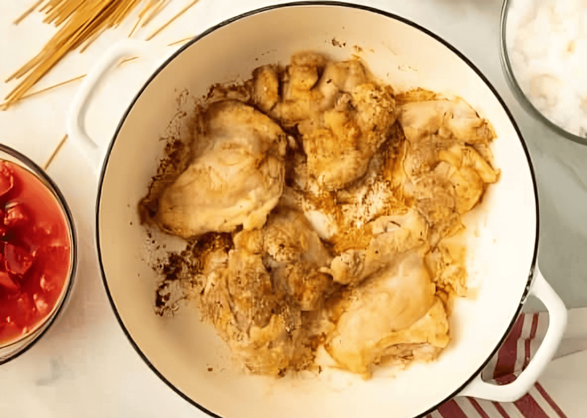 cooked chicken thighs in a dutch oven.