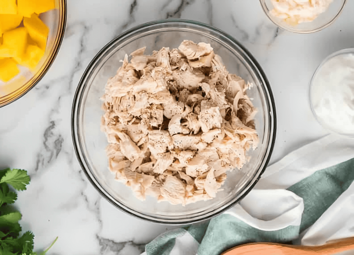 shredded cooked chicken in a bowl.