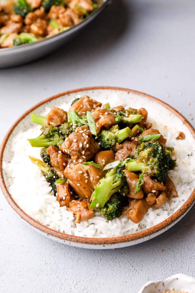 plate of teriyaki chicken and rice with broccoli