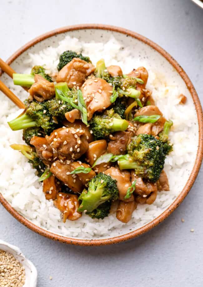 overhead image of teriyaki chicken thighs with broccoli and rice
