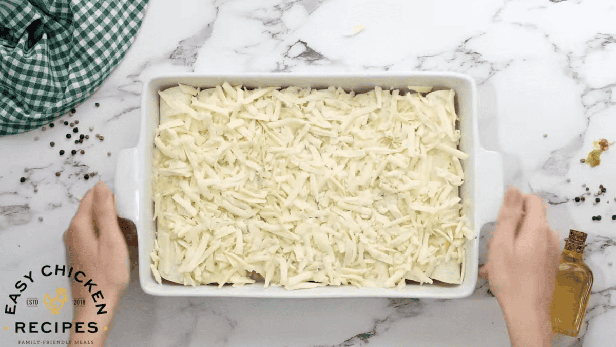 Enchiladas are unbaked and fully assembled in a baking dish