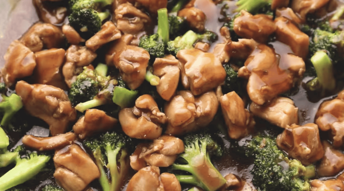 Teriyaki Chicken Thighs and broccoli in a pan.