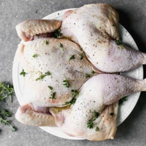 whole chicken flattened on plate