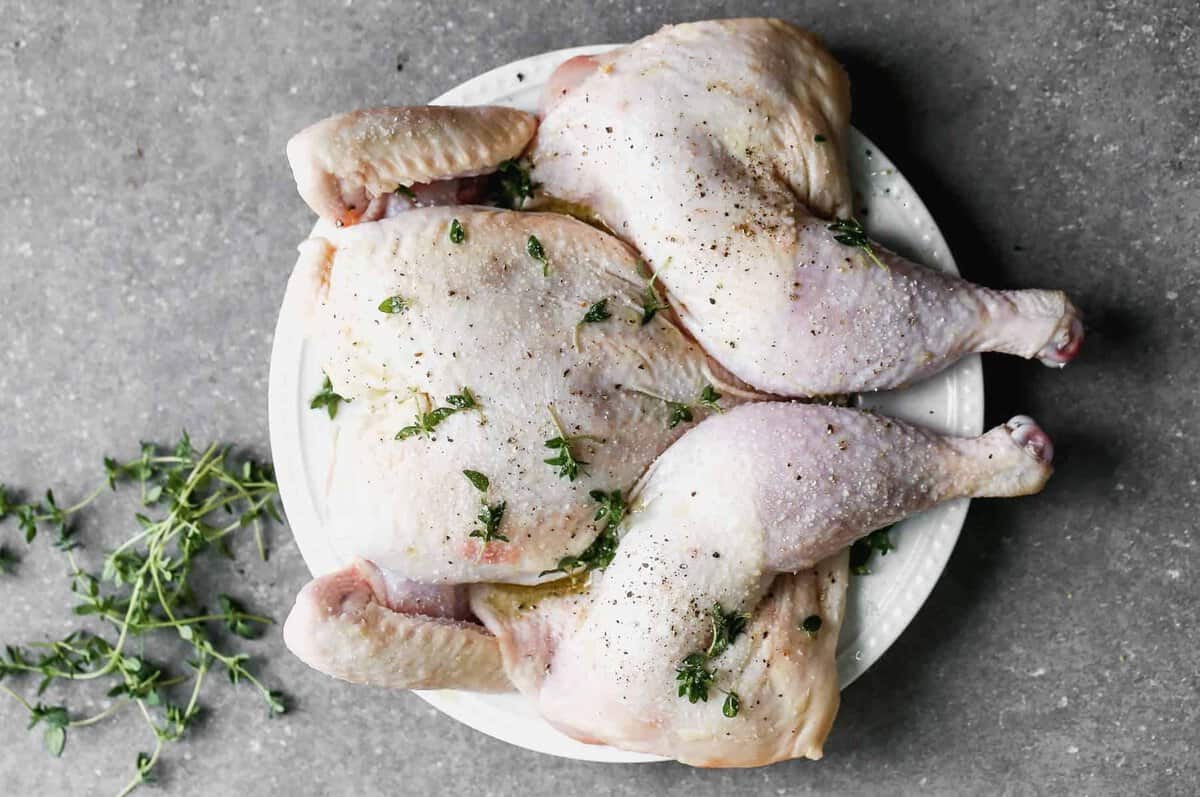 whole chicken flattened on plate