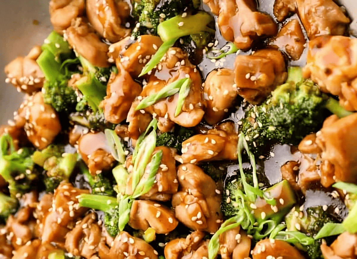 teriyaki chicken thighs and broccoli in a pan.