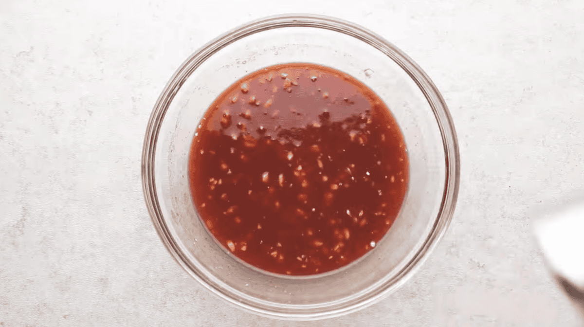bbq sauce is in a glass mixing bowl