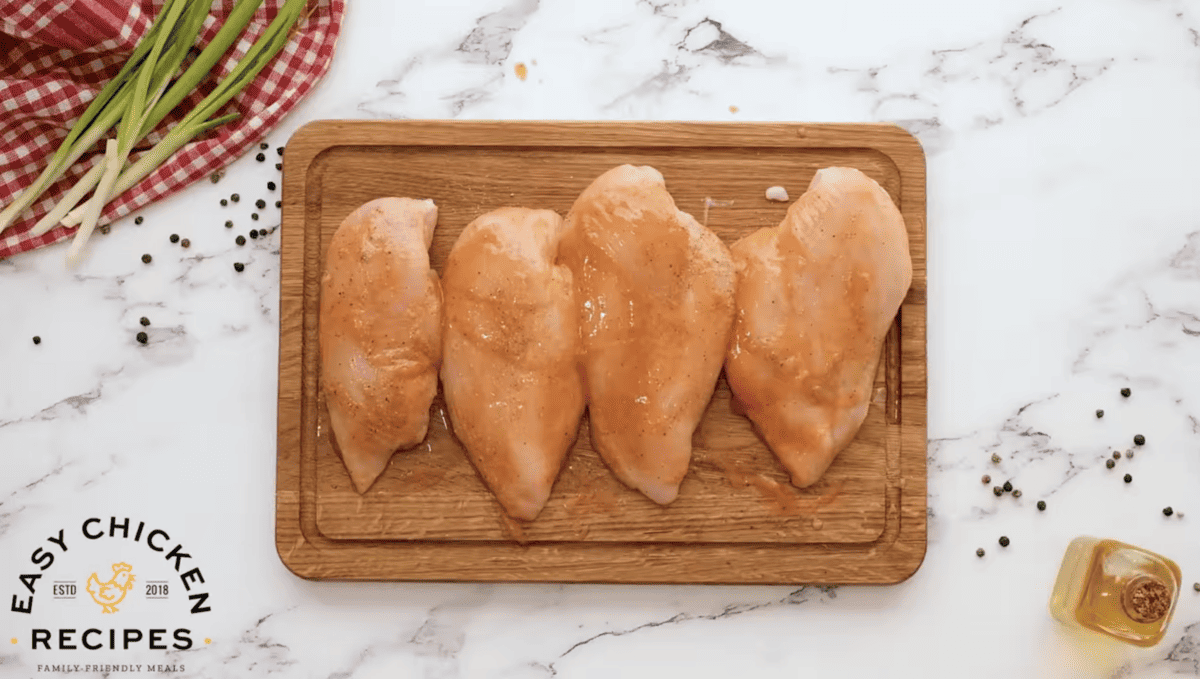 Buffalo sauce has been brushed on chicken breasts. 