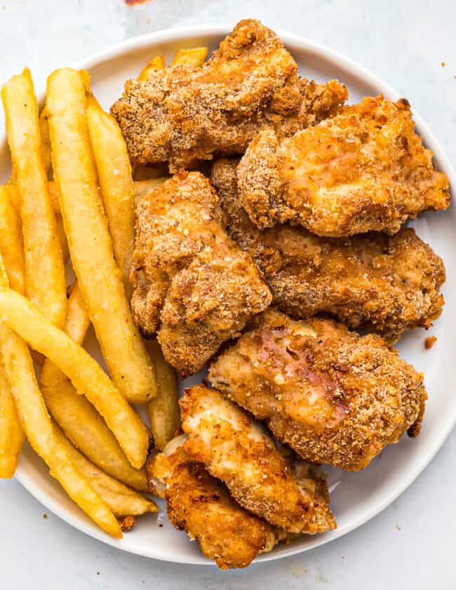 air fryer chicken nuggets with fries on plate