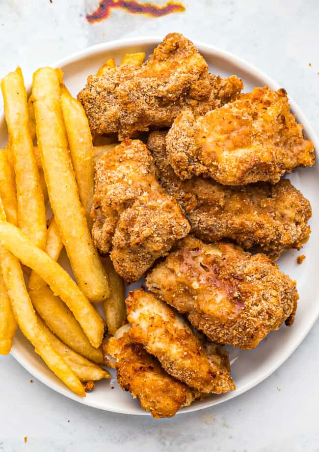 air fryer chicken nuggets with fries on plate