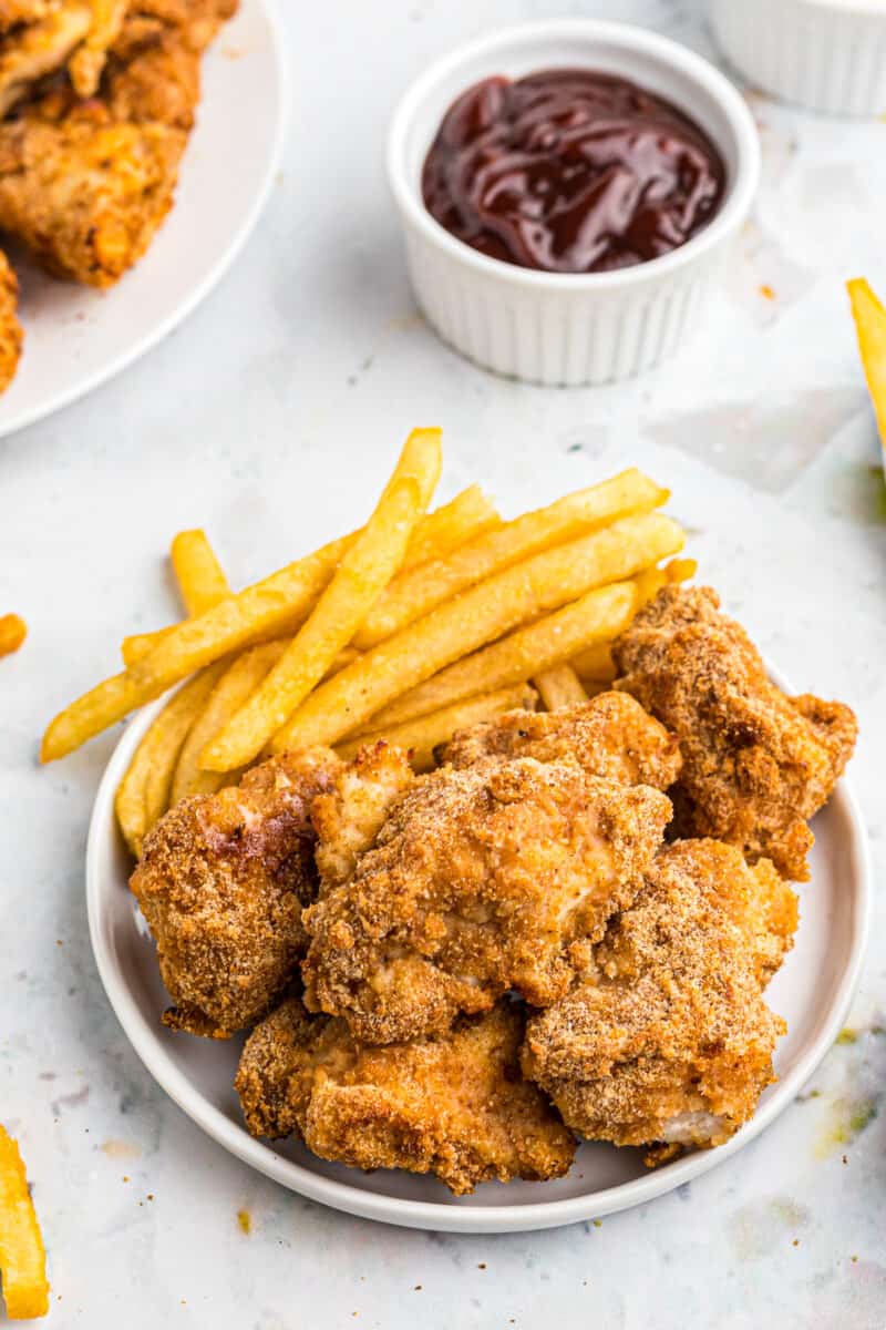 chicken nuggets and fries with bbq sauce