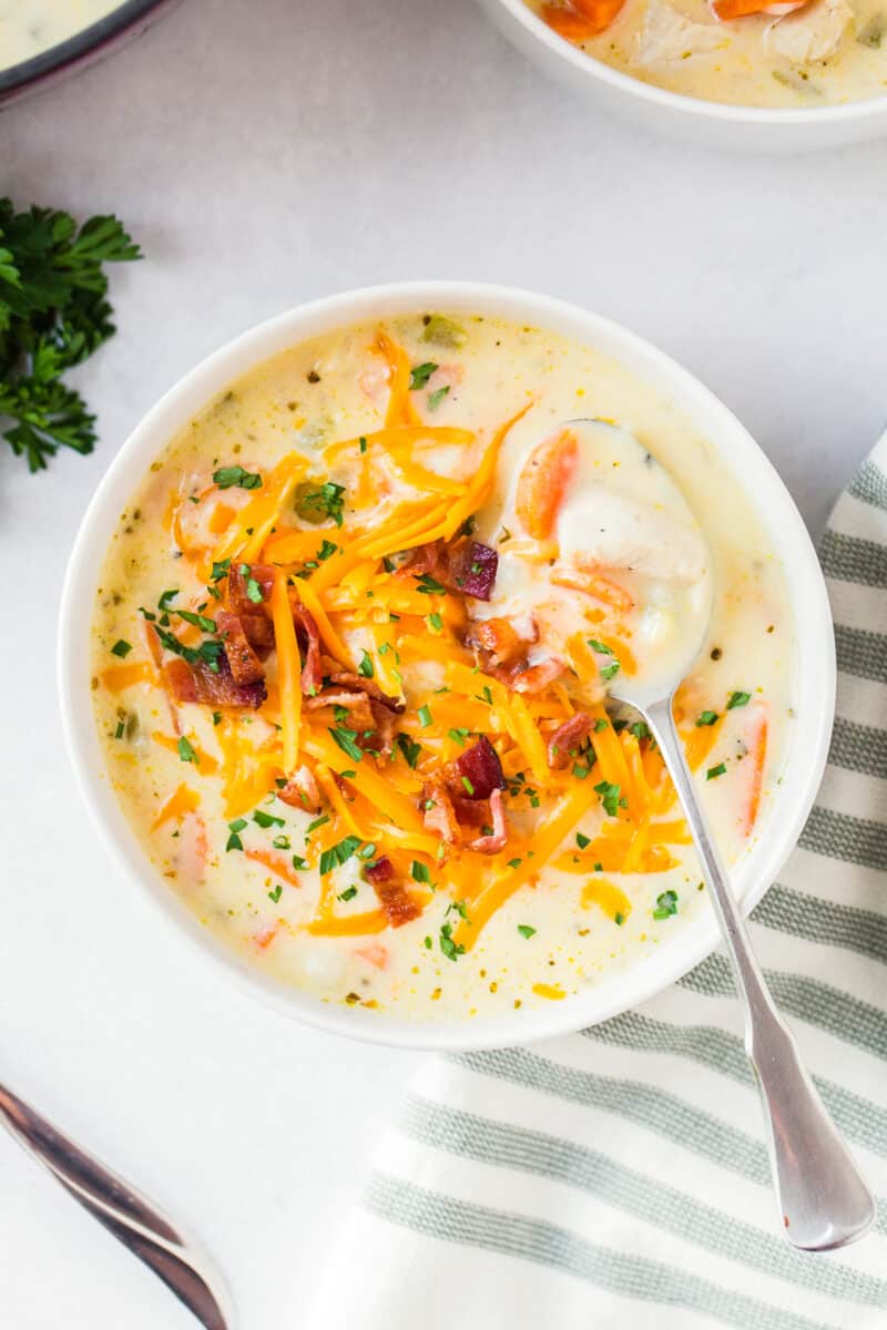overhead image of chicken chowder garnished with cheese and bacon