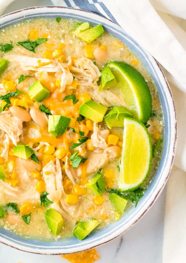 up close image of white chicken slow cooker enchilada soup