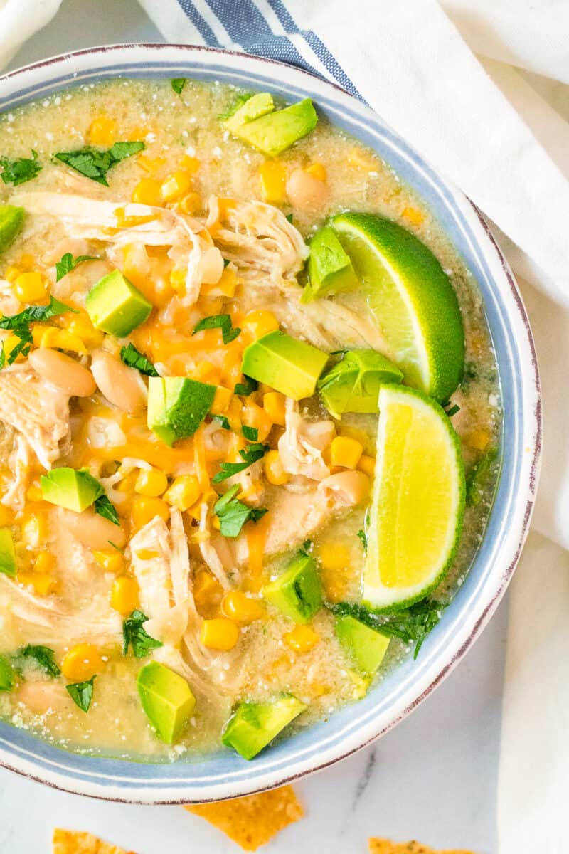 up close image of white chicken slow cooker enchilada soup