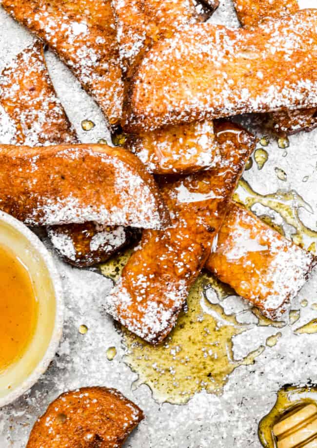 french toast sticks with syrup and powdered sugar