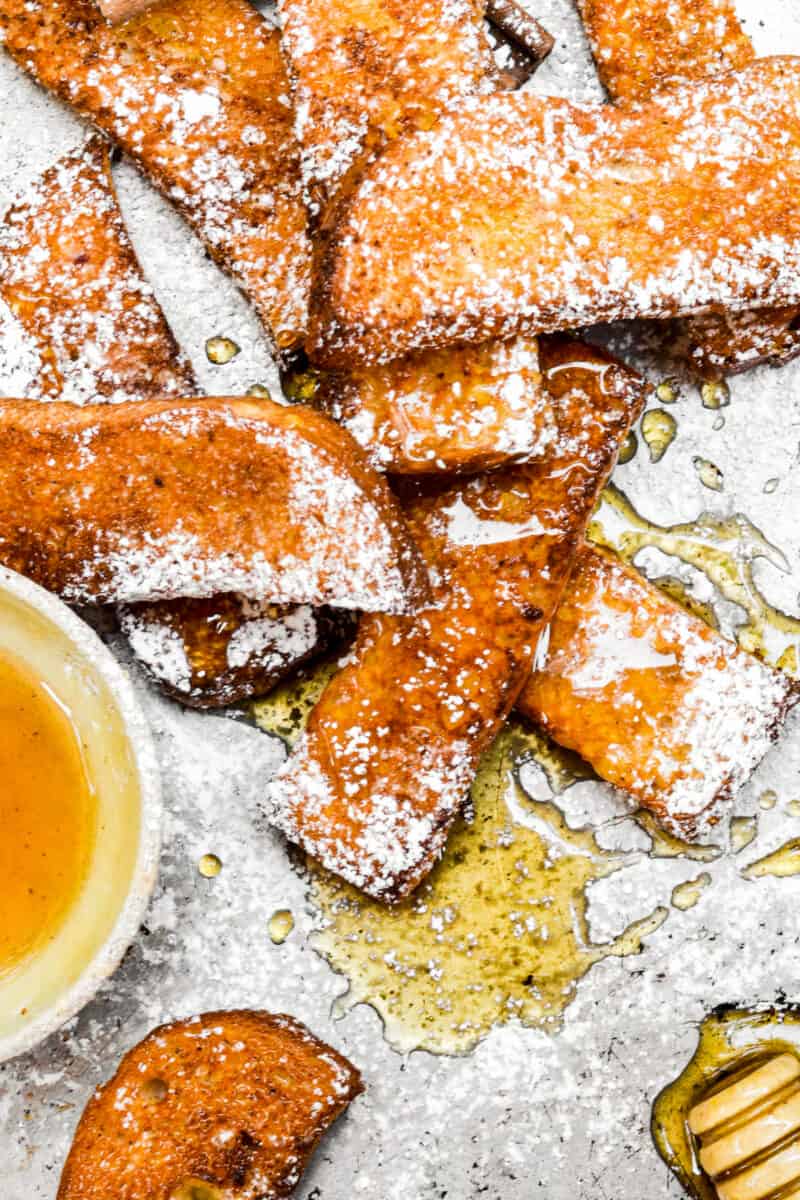 french toast sticks with syrup and powdered sugar