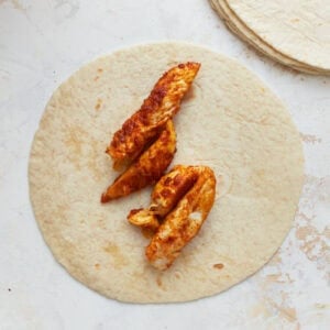 chicken strips on a tortilla.