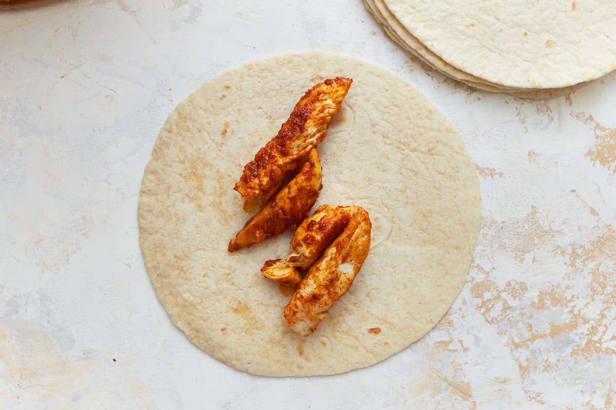 chicken strips on a tortilla.