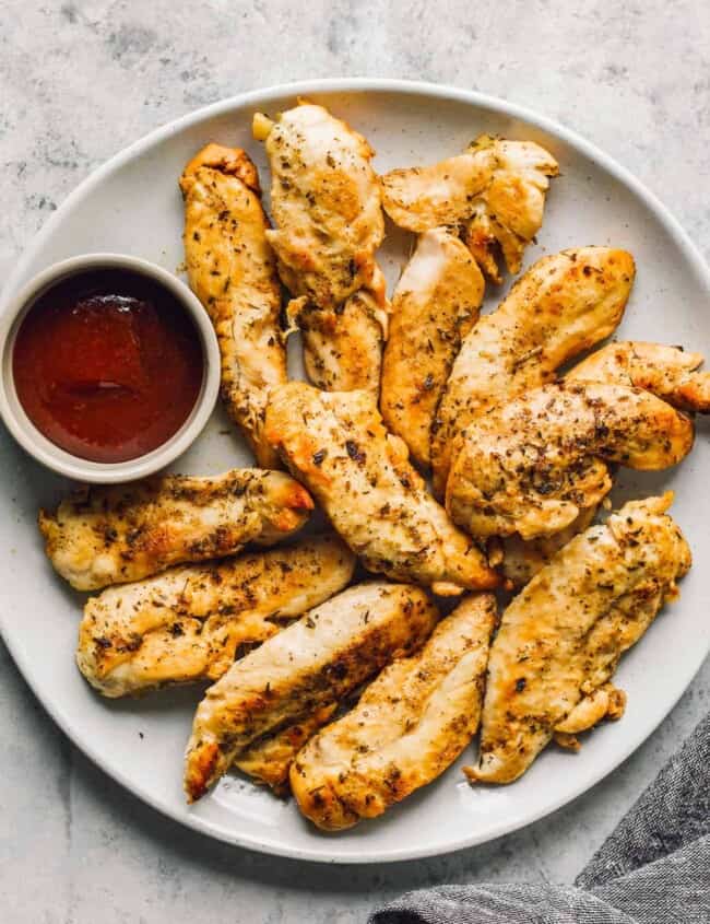 instant pot chicken tenders next to bbq sauce