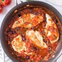 mediterranean chicken with sauce in skillet