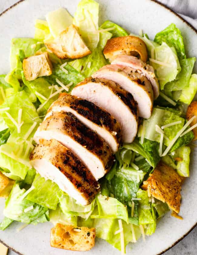 up close overhead image of caesar salad with chicken