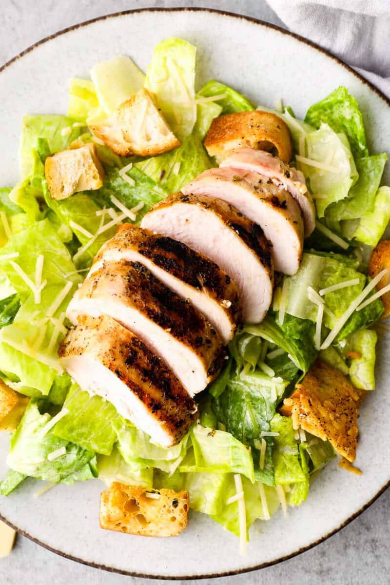 up close overhead image of caesar salad with chicken