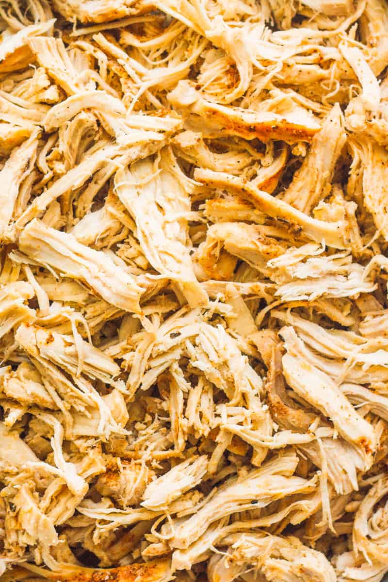 Up close image of crockpot shredded chicken breasts.