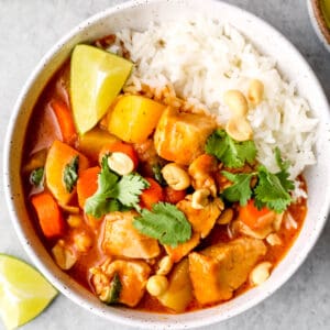 up close image of chicken massaman curry with white rice