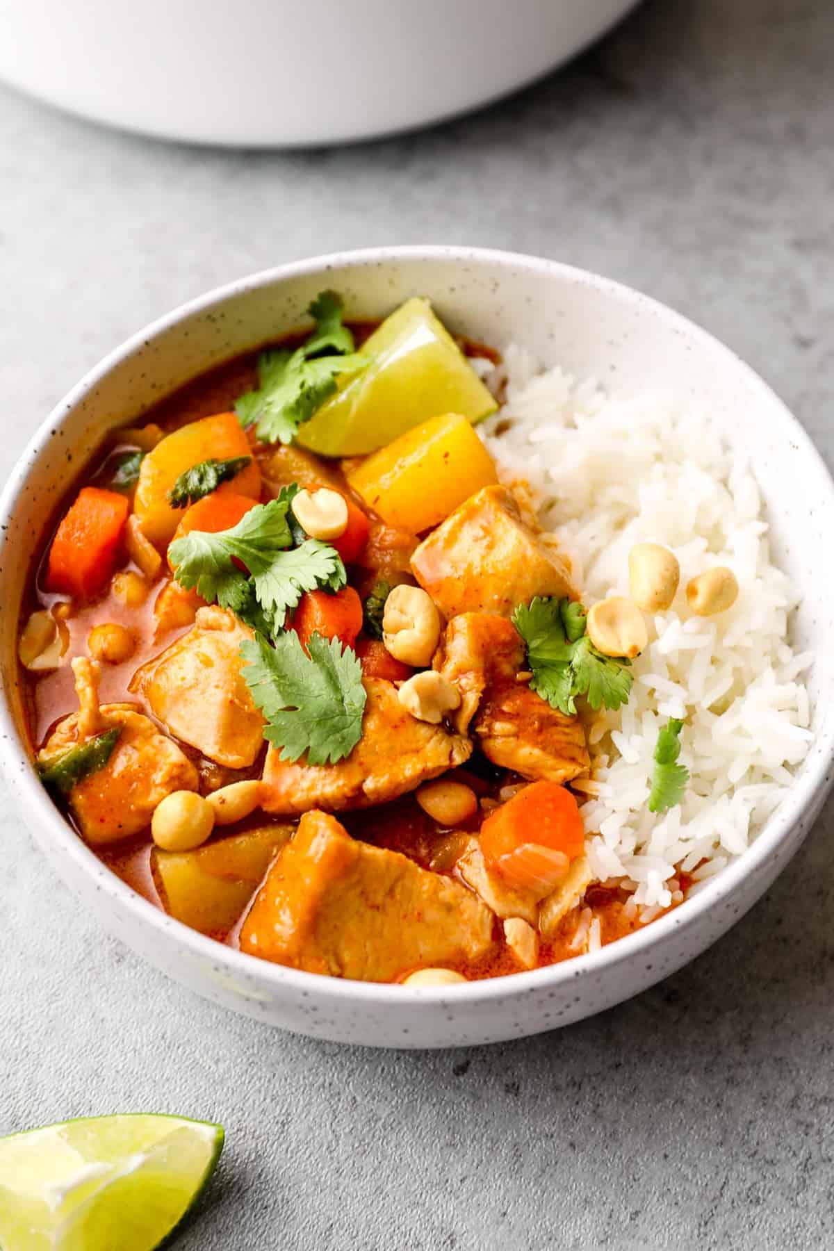 side image of massaman curry garnished with peanuts