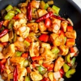 up close image of black skillet with szechuan chicken