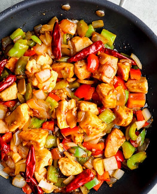 up close image of black skillet with szechuan chicken