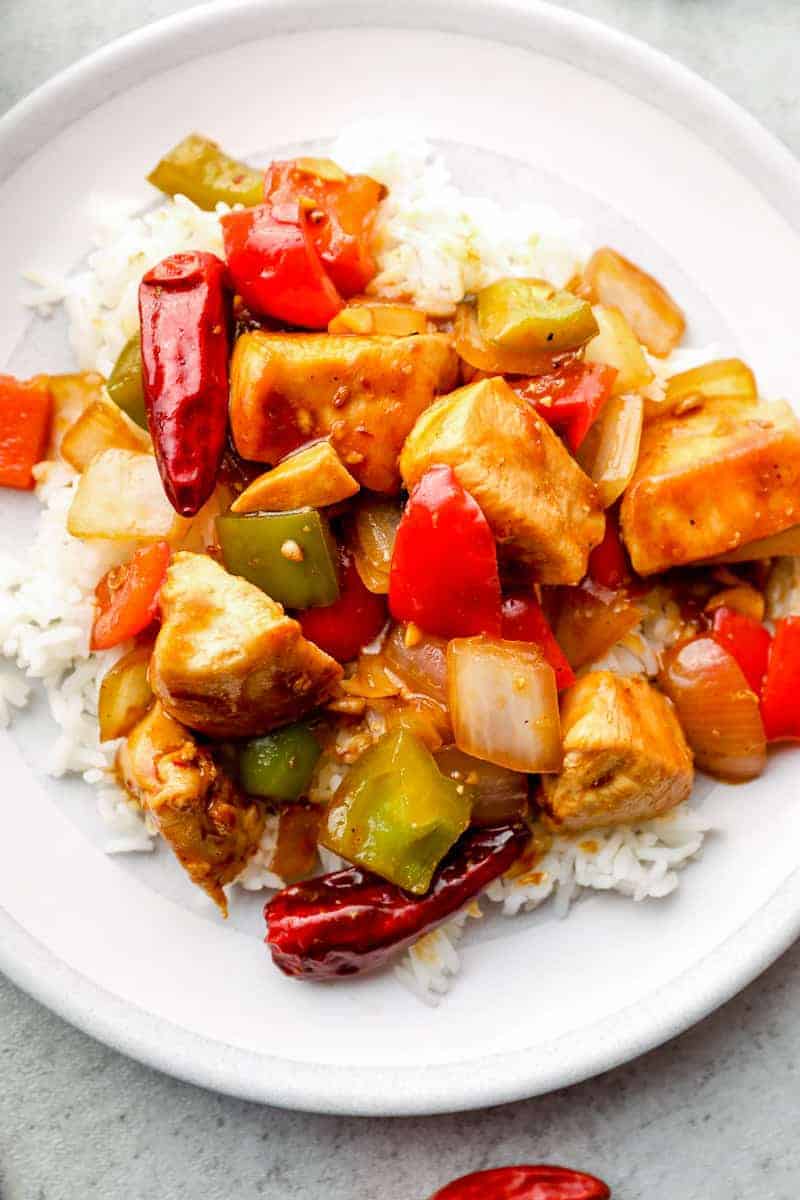 up close image of szechuan chicken with rice