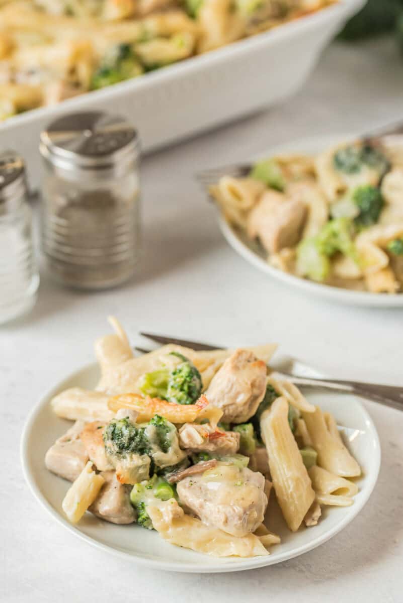 chicken pasta bake with broccoli on plates
