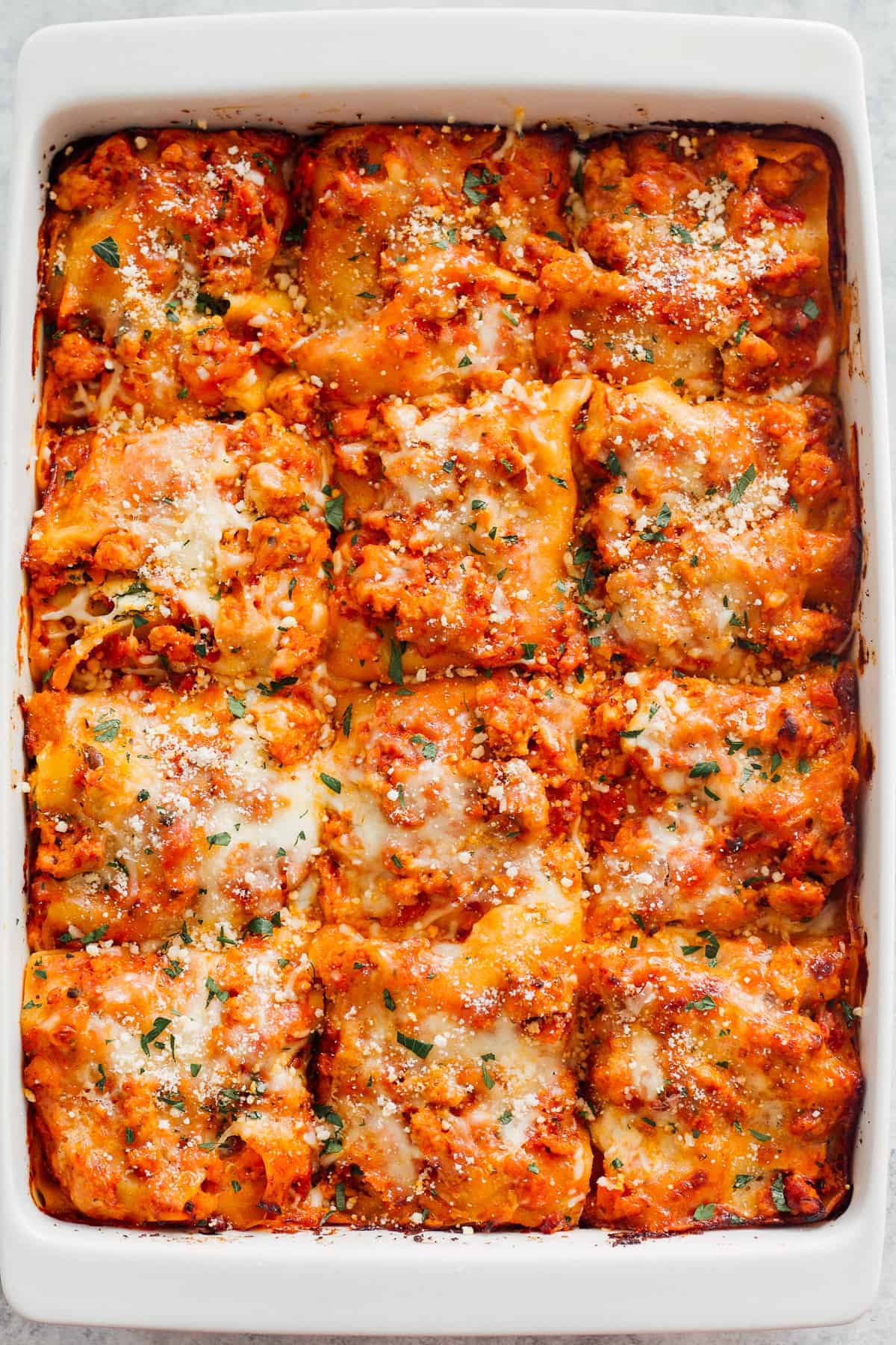 sliced chicken lasagna in baking dish